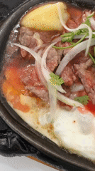 Sizzling Vietnamese Bò Né breakfast captured in Nha Trang