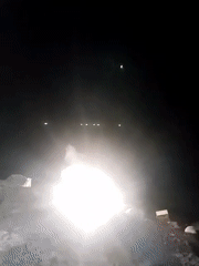Nighttime coastal gathering documented in Lhokseumawe, Indonesia