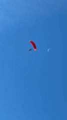 Red paraglider spotted flying near Kazanlak at dawn
