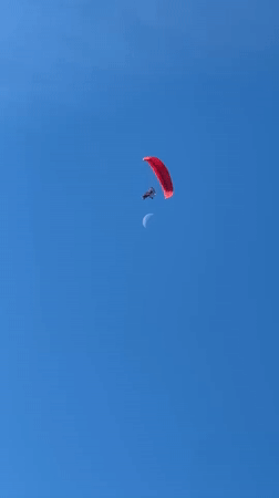 Red paraglider spotted flying near Kazanlak at dawn