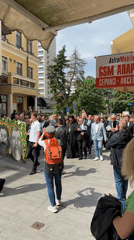 Religious procession with priests, marching band moves through Burgas