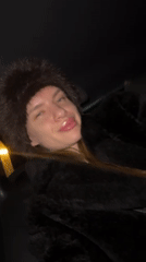 Woman poses playfully in car in Berlin