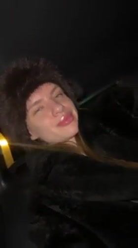 Woman poses playfully in car in Berlin
