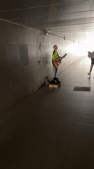 Street musician performs acoustic guitar in Krasnodar underpass