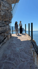 Medieval island town viewed from Budva waterfront walkway