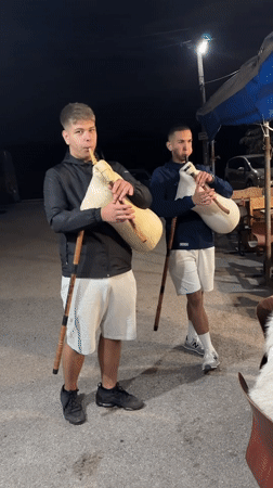 Young musicians perform nighttime bagpipe concert in Bulgarian village