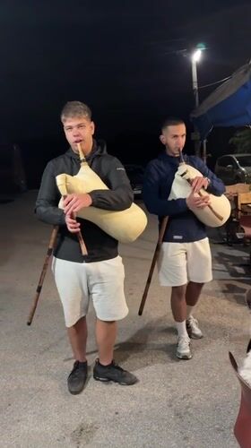 Young musicians perform nighttime bagpipe concert in Bulgarian village
