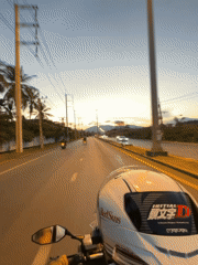 Motorcyclists navigate Kathu roads during sunset commute