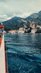 Boat passenger films coastal views near Đurići, Montenegro