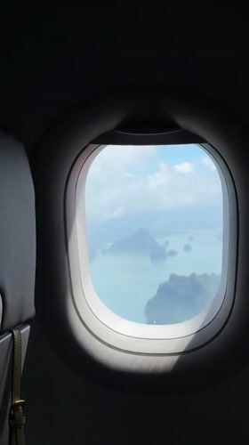 Aerial window view over Thailand's Andaman coastline