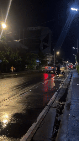 Davao City scenes show wet streets, overflowing trash, university presentation