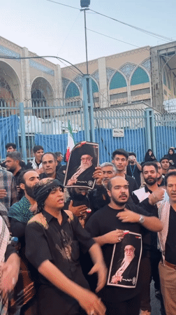 Portrait-holding gathering outside a Tehran mosque