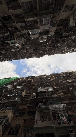 Witness documents Hong Kong's dense high-rise residential landscape from below