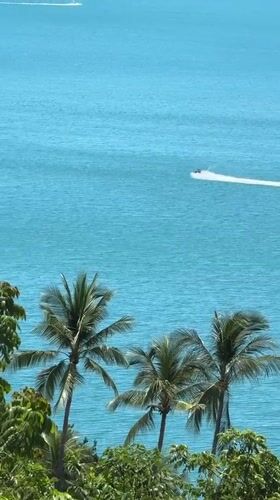 Jet skis cruise ocean waters off Ko Samui coastline