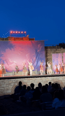 Outdoor dance performance on a mural-backed stage in Veliko Tarnovo