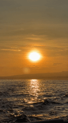 Golden sunrise captured over ocean waters near Banjar, Indonesia