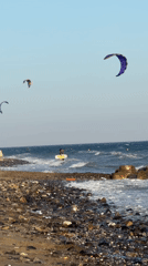 Kite surfers and beachgoers share Estepona's coastline