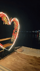 Nighttime waterfront dining scene captured in Ravda, Bulgaria