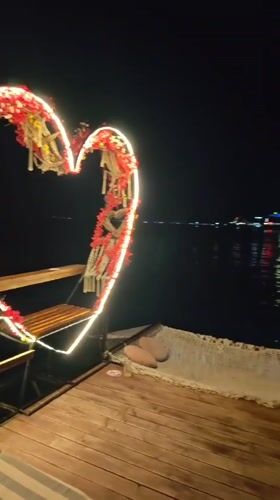 Nighttime waterfront dining scene captured in Ravda, Bulgaria