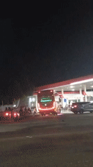 Late-night fuel stop in Sokaraja draws buses, trucks, and street food