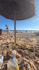 Sunny afternoon beach gathering recorded at Punta Umbría
