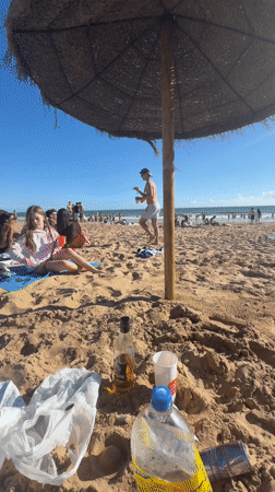 Sunny afternoon beach gathering recorded at Punta Umbría