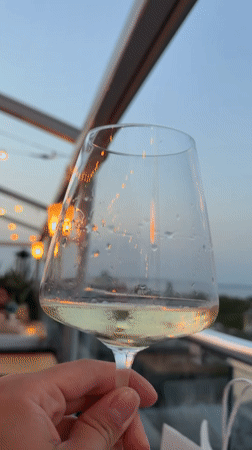 White wine and string lights at an Odesa outdoor spot