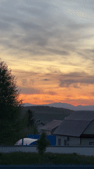 Sunset observed across mixed terrain with scattered daily moments