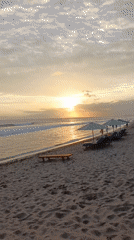 Sunset beach activities documented in North Kuta, Indonesia