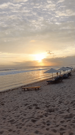 Sunset beach activities documented in North Kuta, Indonesia