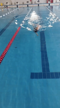 Early morning swimmer trains at indoor pool in Yakutsk