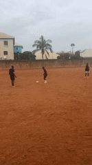 Soccer players practice on dirt field in Nigeria