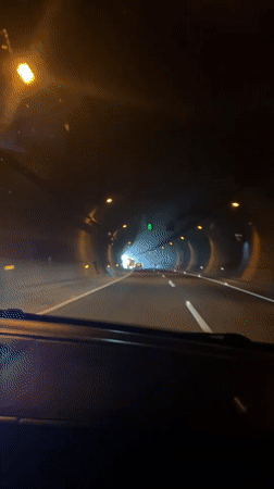 Driving through a lit tunnel in Huauchinango, Mexico