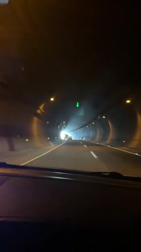 Driving through a lit tunnel in Huauchinango, Mexico