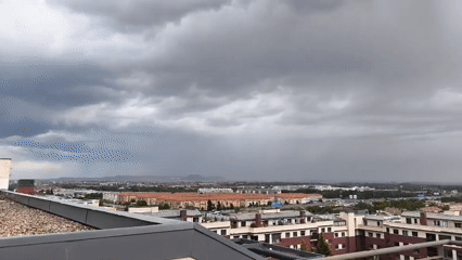 Storm clouds and heavy rain observed over city