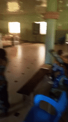 Group performs coordinated dance in church hall