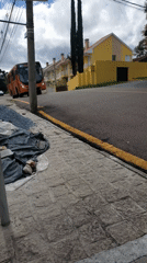 Orange URBS bus passes through Curitiba on regular route