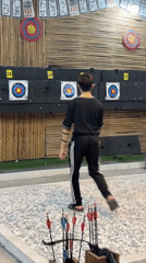 Archery practice captured at decorated indoor range in Đà Nẵng