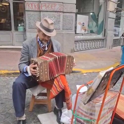 Street musician performs at San Telmo Sunday market