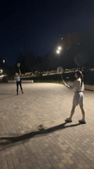 Nighttime badminton in a Krasnogorsk park, streetlights and all.