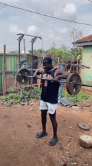 Man conducts outdoor weightlifting session in Akwanga, Nigeria