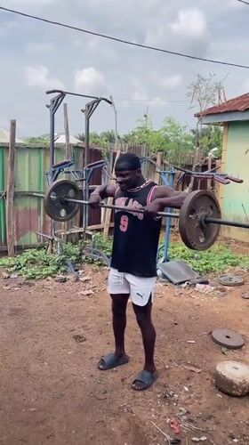 Man conducts outdoor weightlifting session in Akwanga, Nigeria