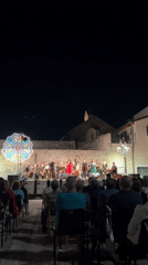 Live band concert in Bitonto's historic town square at night