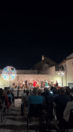 Live band concert in Bitonto's historic town square at night