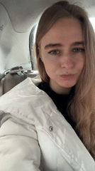 Woman filmed during car ride past urban sculpture