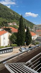 Quiet domestic moments captured from Budva balcony during lunch hour