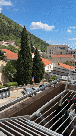 Quiet domestic moments captured from Budva balcony during lunch hour