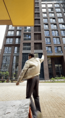 Dancing and posing between modern brick towers in Moscow