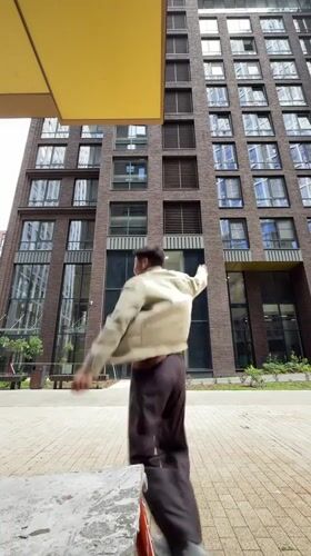 Dancing and posing between modern brick towers in Moscow