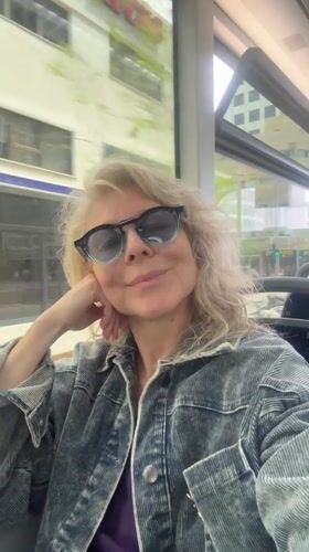 Woman on Tel Aviv bus observed near modern building